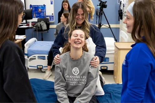 Occupational Therapy students practice with each other in a simulated hospital setting
